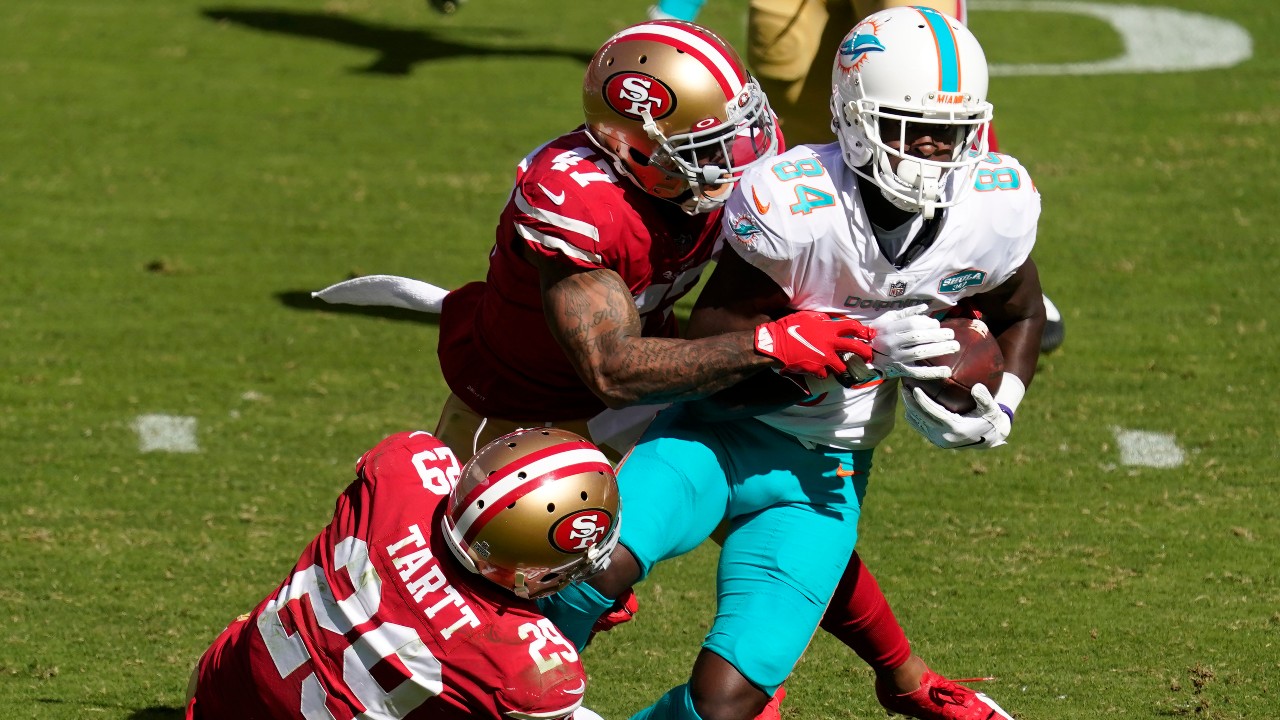 Miami Dolphins wide receiver Isaiah Ford (84) runs against San Francisco 49ers strong safety Jaquiski Tartt (29) cornerback Jamar Taylor (47) during the first half of an NFL football game in Santa Clara, Calif., Sunday, Oct. 11, 2020. (Tony Avelar / AP)