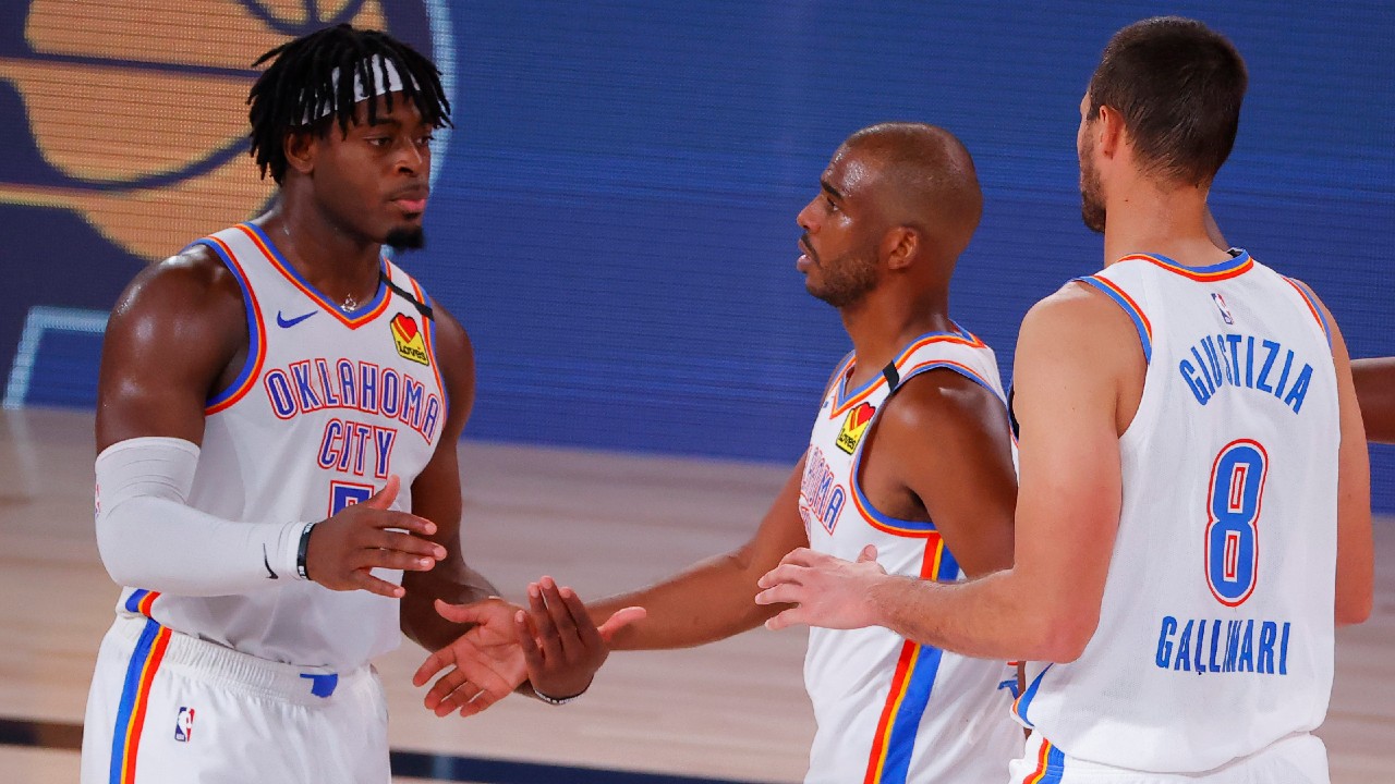 Oklahoma City Thunder's Chris Paul, centre, celebrates a win over the Houston Rockets with teammates Luguentz Dort, left, and Danilo Gallinari (8). (Kevin C. Cox/Pool Photo via AP)