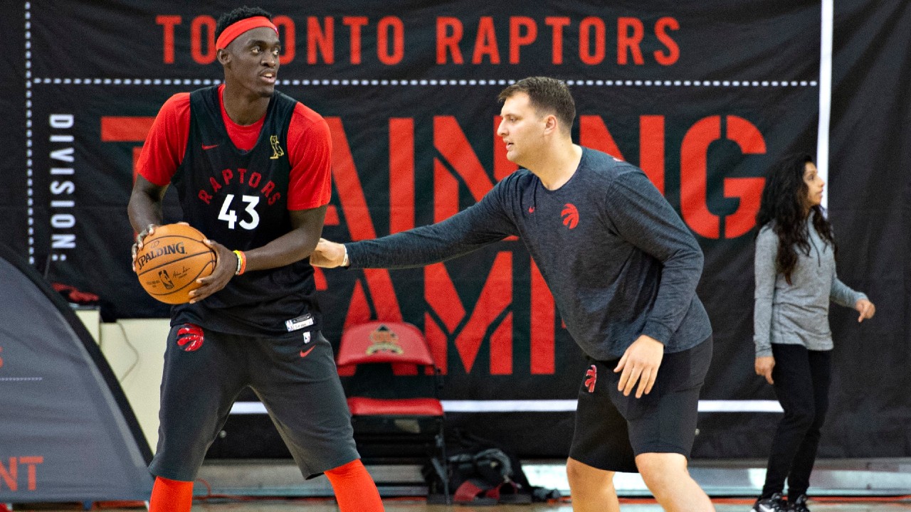 Toronto Raptors star Pascal Siakam keeps the ball away from assistant coach John Corbacio. (Jacques Boissinot/CP)