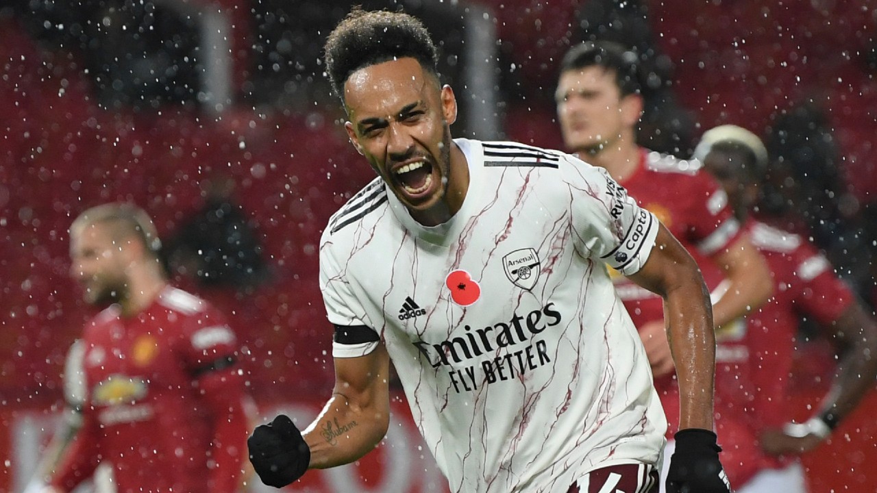 Arsenal's Pierre-Emerick Aubameyang celebrates after scoring a goal against Manchester United. (Shaun Botterill/Pool via AP)