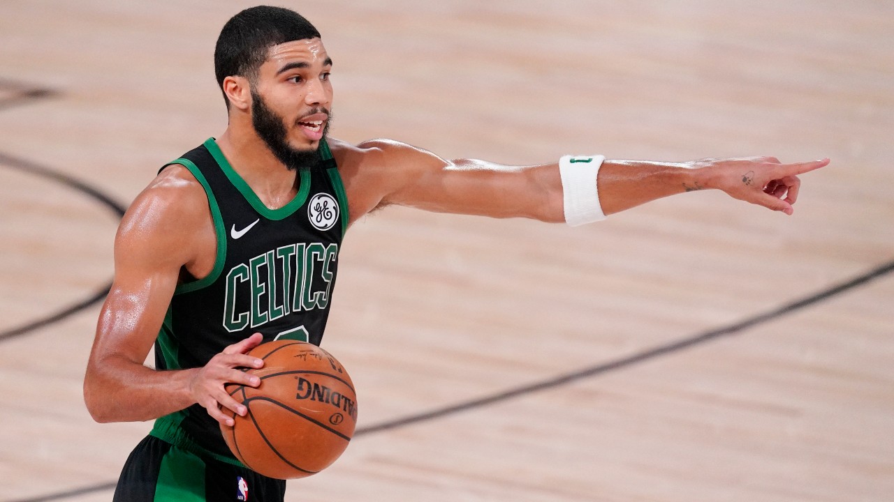 Boston Celtics' Jayson Tatum (0) directs a play during the second half of an NBA conference final playoff basketball game against the Miami Heat. (Mark J. Terrill/AP) 
