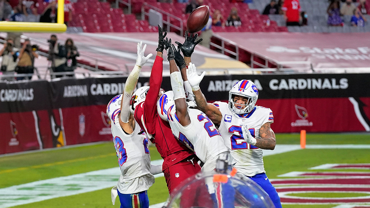 Arizona Cardinals wide receiver DeAndre Hopkins (10) catches the game-winning touchdown as Buffalo Bills cornerback Tre'Davious White, right, free safety Jordan Poyer (21) and strong safety Micah Hyde, left, defend during the second half of an NFL football game, Sunday, Nov. 15, 2020, in Glendale, Ariz. The Cardinals won 32-20. (Ross D. Franklin/AP)