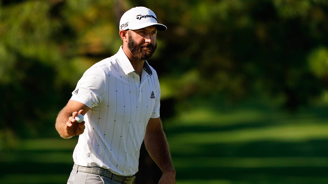 Dustin Johnson waves his ball after a birdie on the seventh hole during the third round of the Masters golf tournament Saturday, Nov. 14, 2020, in Augusta, Ga. (Matt Slocum/AP)