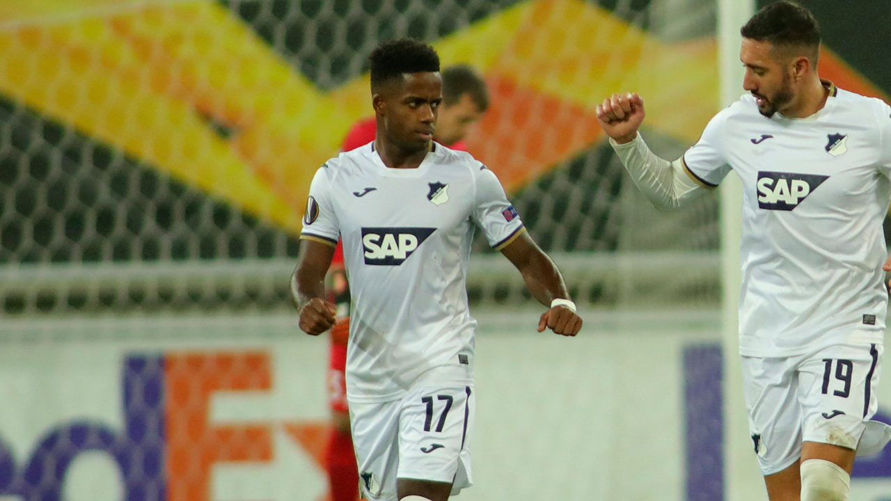 Ryan Sessegnon, centre, celebrates a goal with Hoffenheim teammate Ishak Belfodil, right, during the Europa League Group L match between Gent and Hoffenheim at the KAA Gent stadium in Gent, Belgium, Thursday, Oct. 29, 2020. (Olivier Matthys/AP)