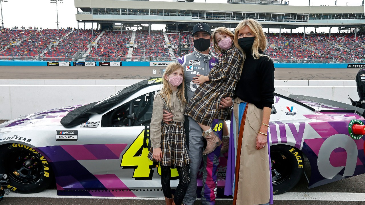 Jimmie Johnson, center, stands with his family on pit road prior to a NASCAR Cup Series auto race at Phoenix Raceway, Sunday, Nov. 8, 2020, in Avondale, Ariz. (Ralph Freso/AP)