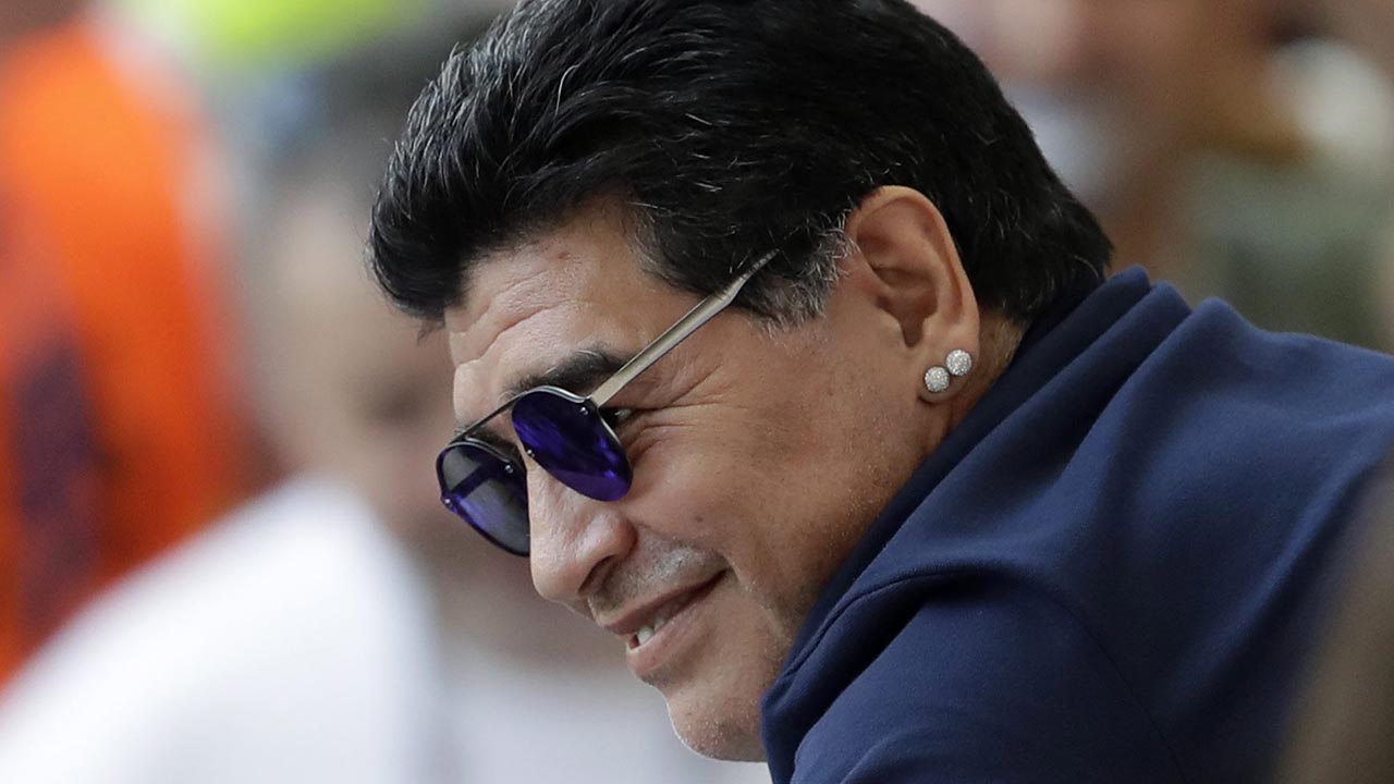 FILE - In this June 30, 2018 file photo, Argentinian soccer legend Diego Armando Maradona smiles prior to a match at the 2018 soccer World Cup in the Kazan Arena, in Kazan, Russia. Maradona's lawyer said Friday, March 8, 2019, that the former soccer star and current coach of Mexican club Dorados of Sinaloa will legally recognize three children that he fathered in Cuba. (AP Photo/Sergei Grits, File)