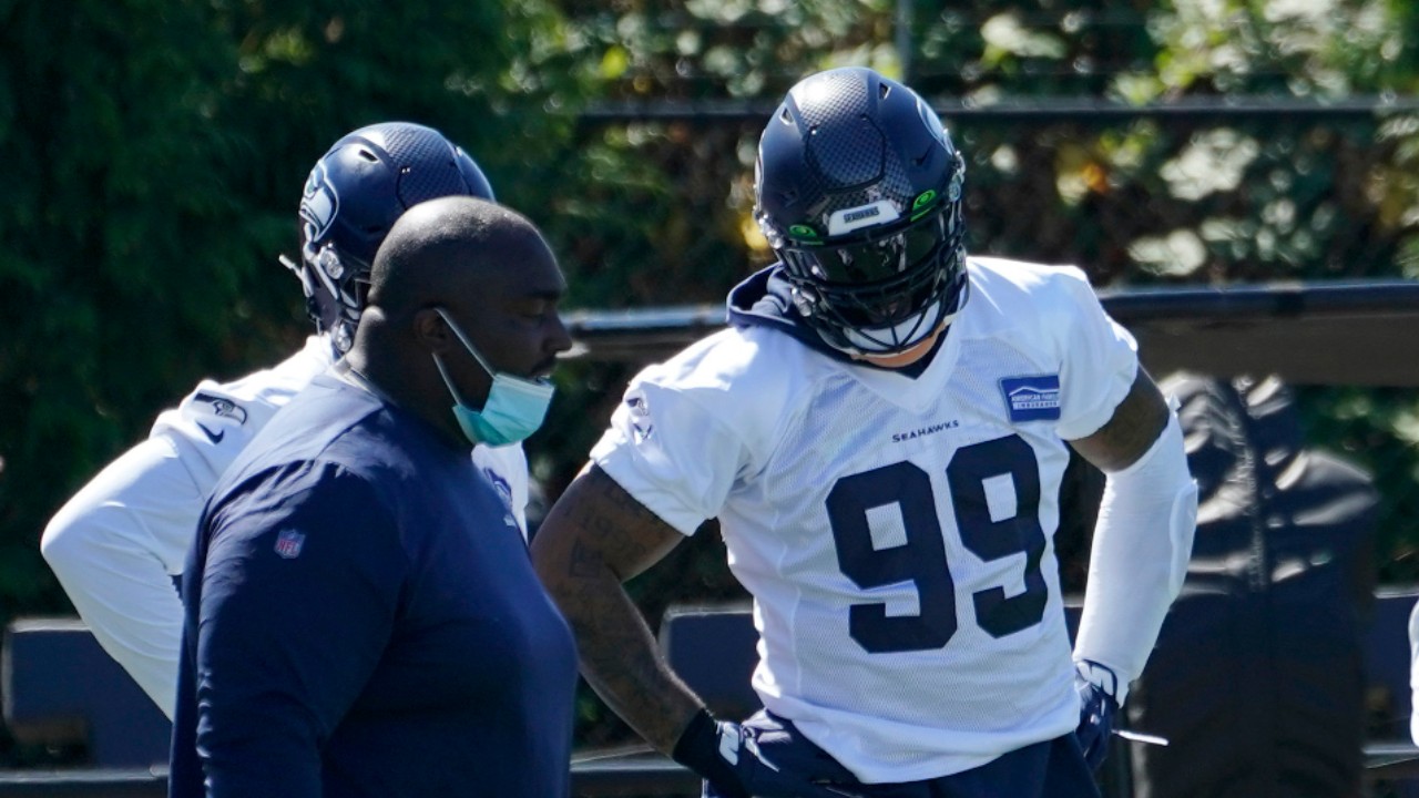 Seattle Seahawks defensive end Damontre Moore (99) stands with teammates during NFL football training camp, Thursday, Sept. 3, 2020, in Renton, Wash. (Ted S. Warren/AP)