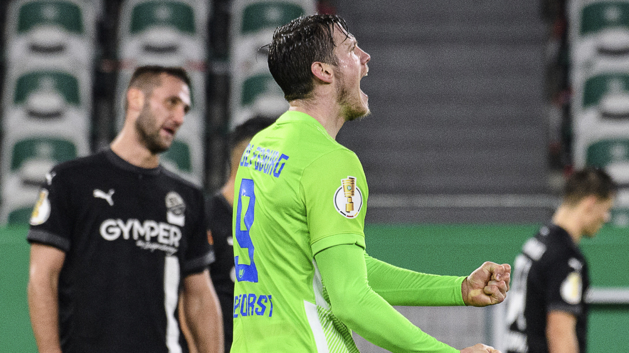 Wolfsburg's Wout Weghorst celebrates after scoring the 4-0 goal, during the German Cup 2nd round soccer match between VfL Wolfsburg and SV Sandhausen at Volkswagen Arena, in Wolfsburg, Germany, Wednesday, Dec. 23, 2020. (Swen Pf'rtner/dpa via AP)