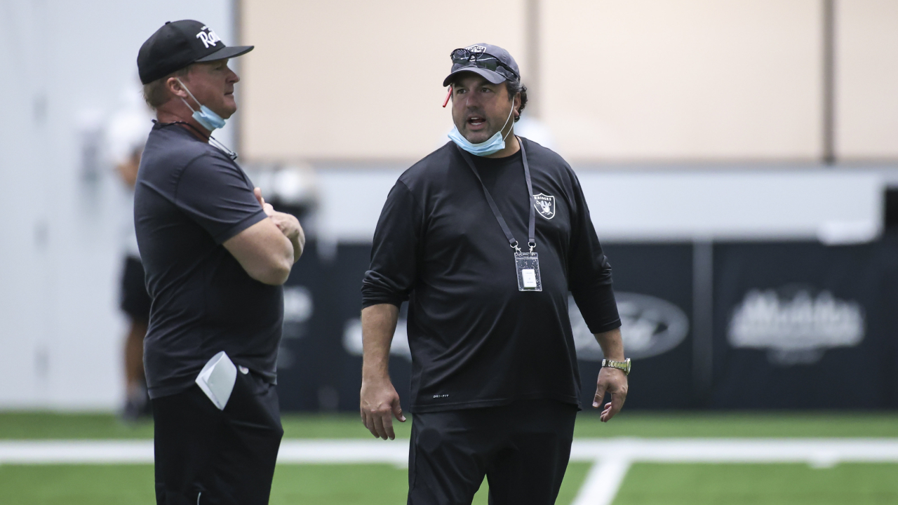 Las Vegas Raiders head coach Jon Gruden, left, talks with defensive coordinator Paul Guenther during an NFL football training camp practice Tuesday, Aug. 25, 2020, in Henderson, Nev. (Chase Stevens/Las Vegas Review-Journal via AP, Pool)