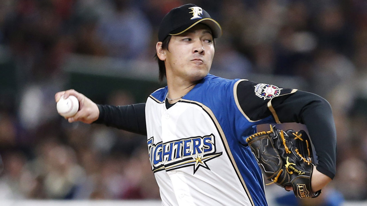 Nippon Ham Fighters starter Kohei Arihara pitches against the Oakland Athletics in the first inning of their preseason exhibition baseball game. (Toru Takahashi/AP)