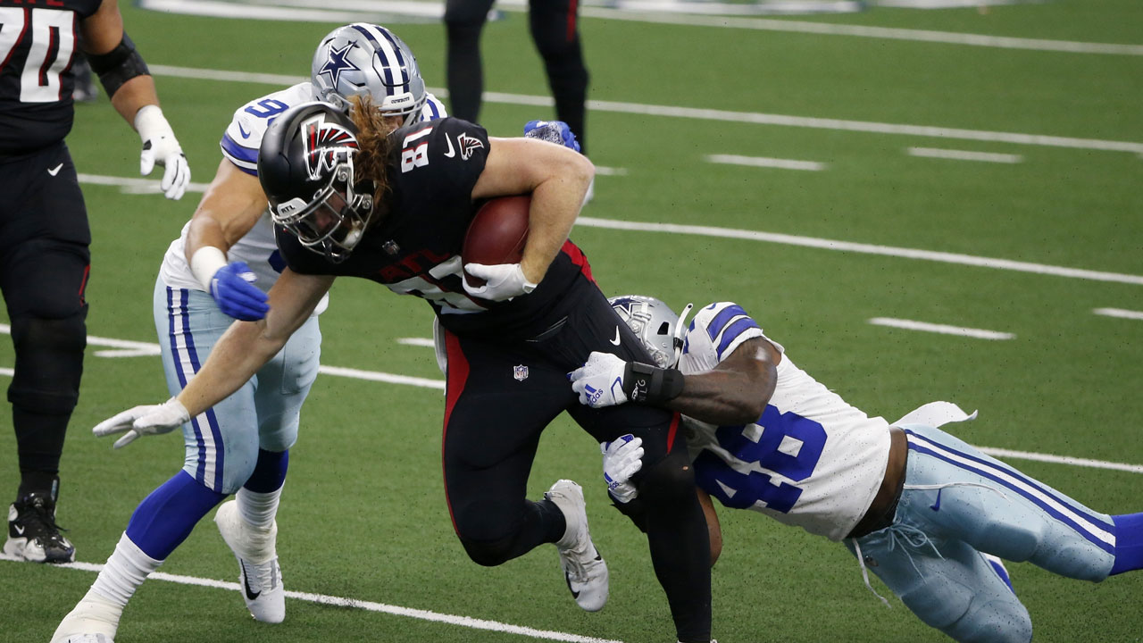 Atlanta Falcons tight end Hayden Hurst (81) is brought down by Dallas Cowboys' L.P. LaDouceur, left and linebacker Joe Thomas (48) in the first half of an NFL football game. (Michael Ainsworth/AP)