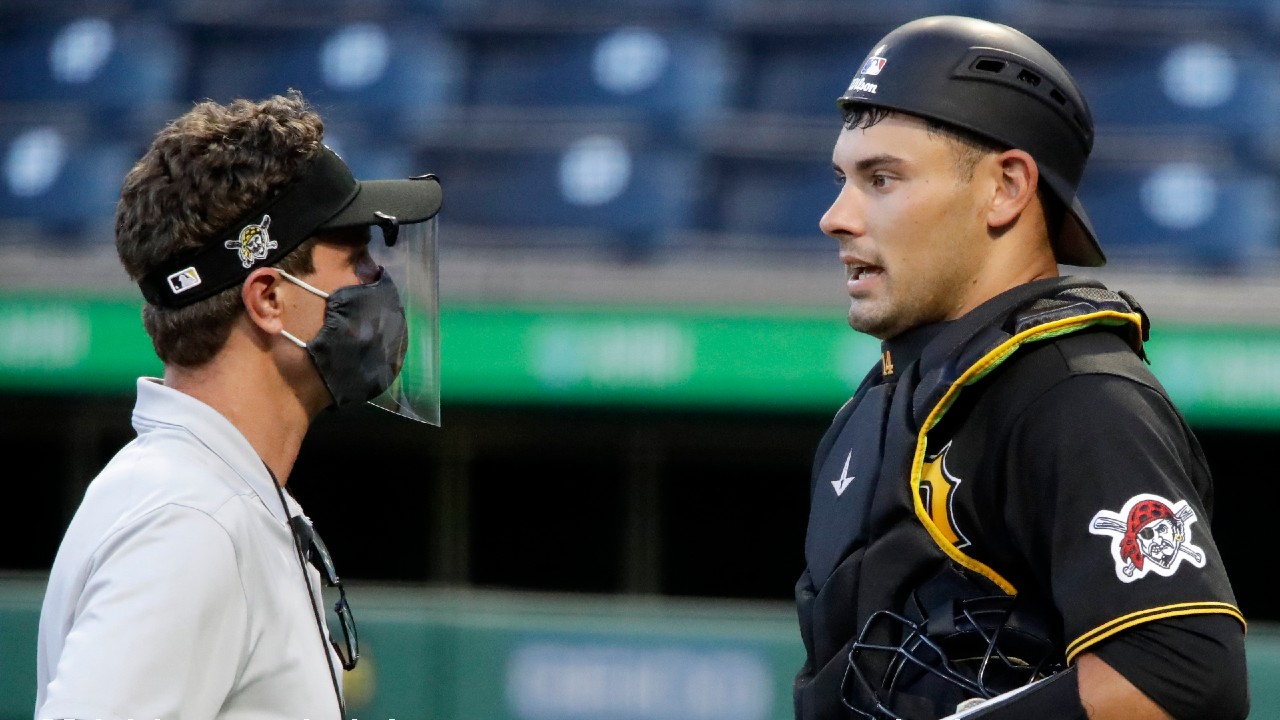 In this July 15, 2020, file photo, Pittsburgh Pirates catcher Luke Maile, right, talks with a trainer during an intrasquad baseball game at PNC Park in Pittsburgh. Maile underwent surgery to repair a fractured right index finger on Friday, July 17. (Gene J. Puskar/AP)