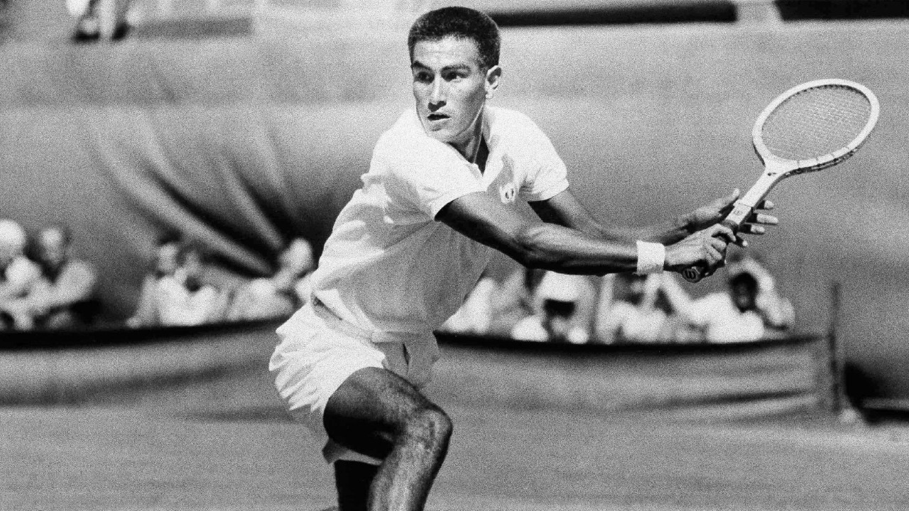 Alex Olmedo prepares to make a backhand return during a match against Neale Fraser in the finals of the Australian National Championships in Adelaide, Australia, in this Jan. 26, 1959, file photo. (AP Photo/File)