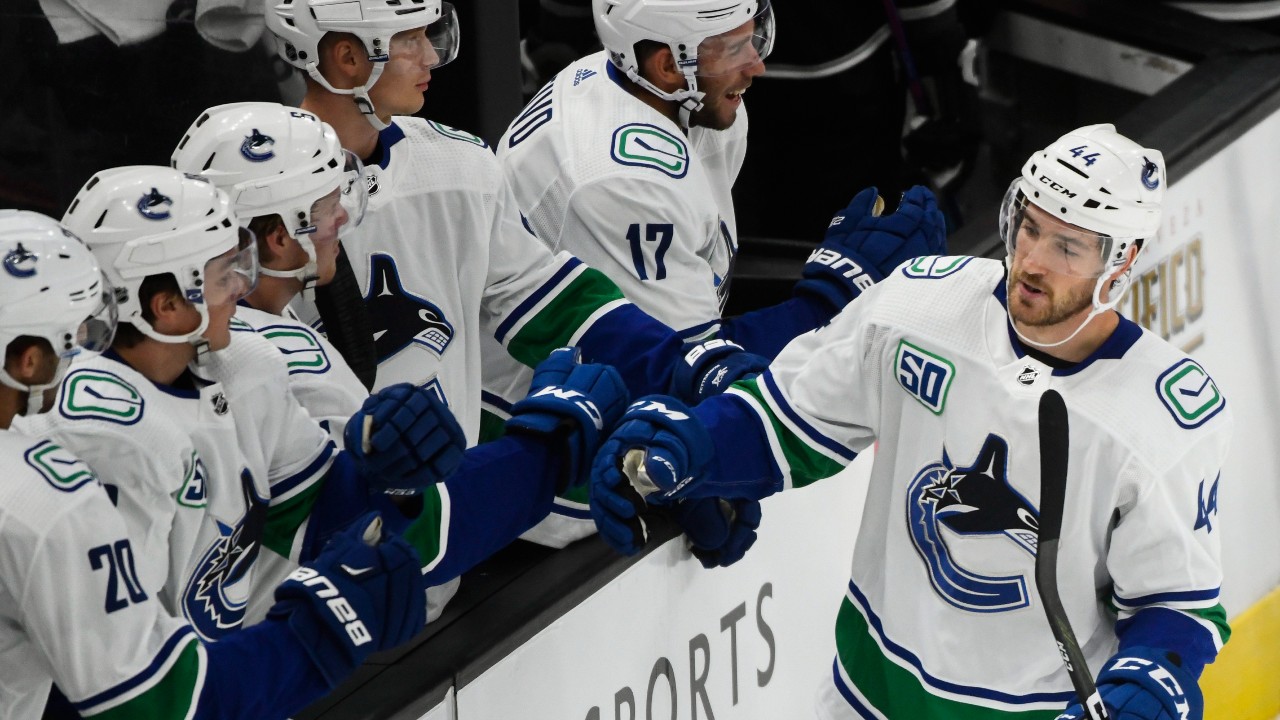 Vancouver Canucks center Tyler Graovac celebrates his goal with teammates during the first period of a preseason NHL hockey game against the Los Angeles Kings, Saturday, Sept. 21, 2019, in Salt Lake City. (Alex Goodlett / AP)