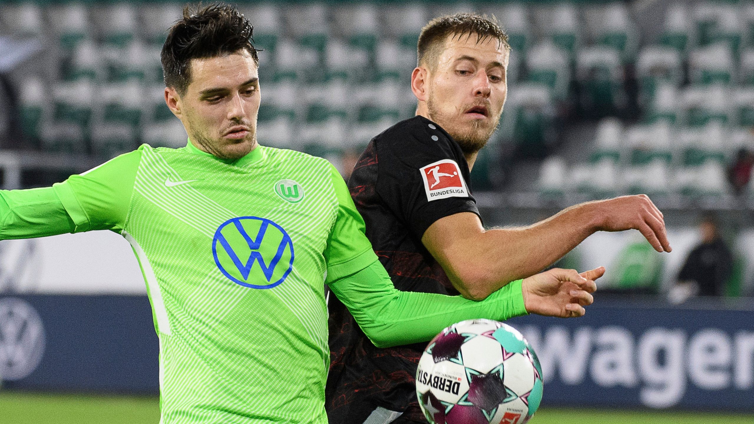 Wolfsburg's Josip Brekalo, left, plays against Stuttgart's Waldemar Anton during the German Bundesliga soccer match between VfL Wolfsburg and VfB Stuttgart. (Swen Pf'rtner/dpa via AP)