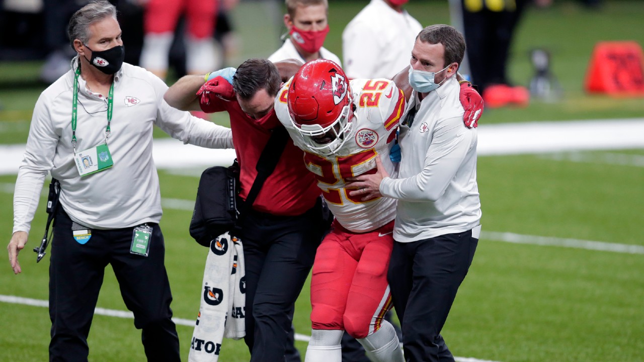 Kansas City Chiefs running back Clyde Edwards-Helaire (25) is helped off the field after being injured in the second half of an NFL football game against the New Orleans Saints in New Orleans, Sunday, Dec. 20, 2020. (Brett Duke/AP)
