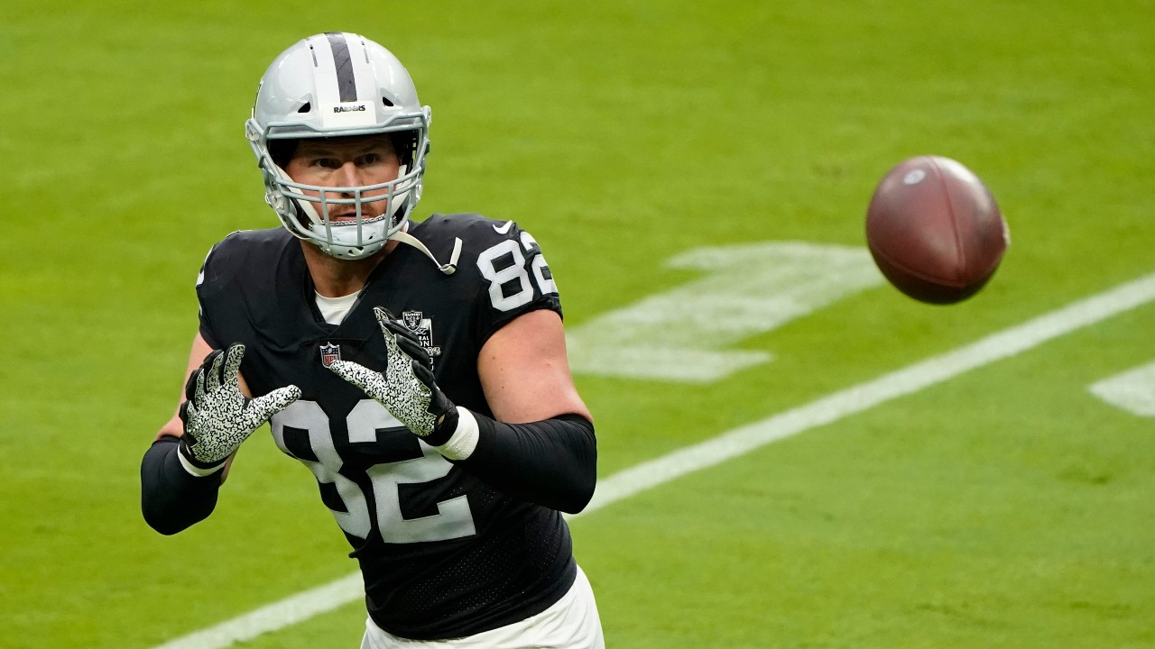 Las Vegas Raiders tight end Jason Witten (82) catches a ball during an NFL football training camp practice. (AP Photo/John Locher)