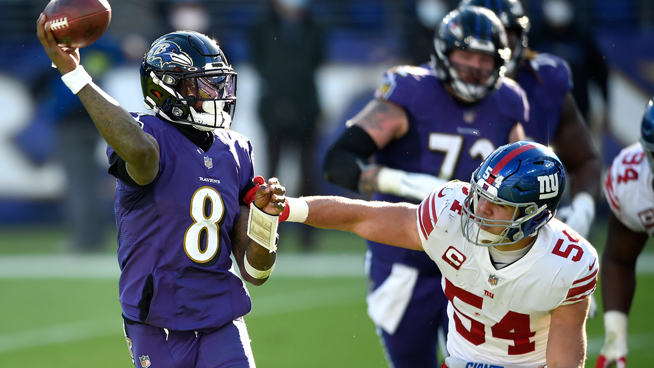 Baltimore Ravens quarterback Lamar Jackson (8) looks to throw a pass as New York Giants inside linebacker Blake Martinez (54) applies pressure during the first half of an NFL football game, Sunday, Dec. 27, 2020, in Baltimore. (Gail Burton/AP)