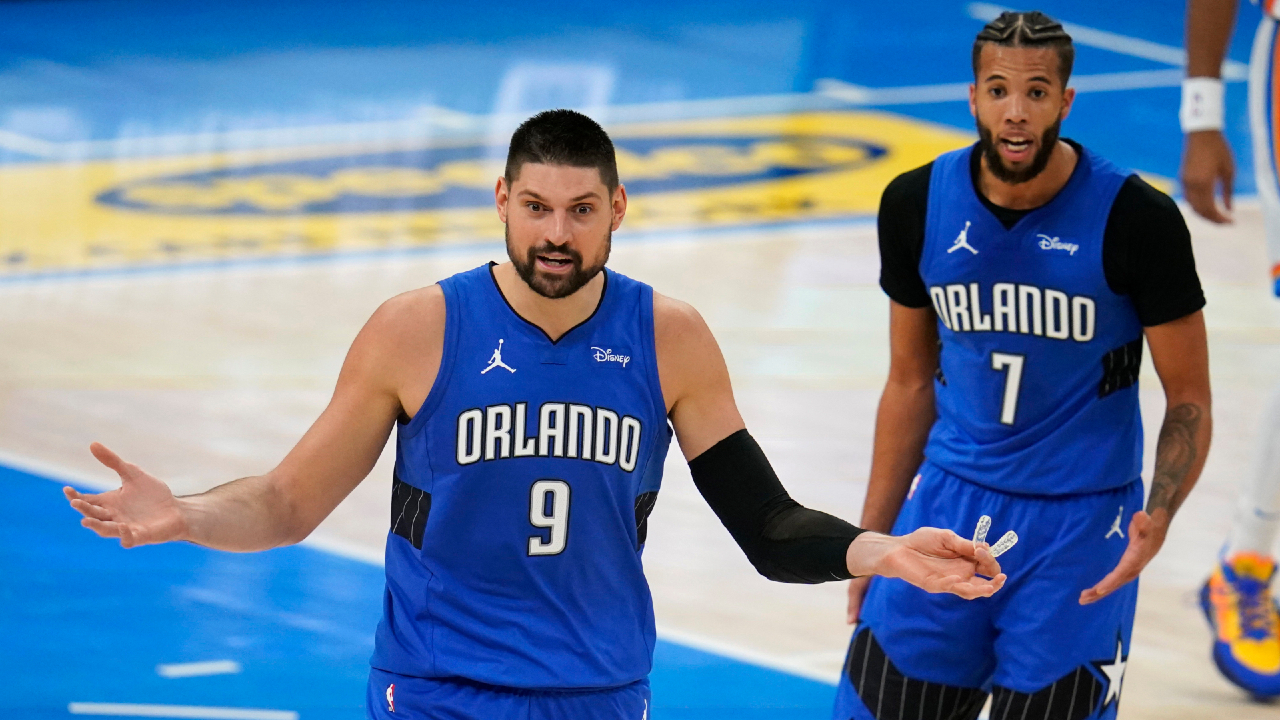 Orlando Magic center Nikola Vucevic (9) and guard Michael Carter-Williams (7) react to a call during the second half of the team's NBA basketball game against the Oklahoma City Thunder, Tuesday, Dec. 29, 2020, in Oklahoma City. (Sue Ogrocki/AP)
