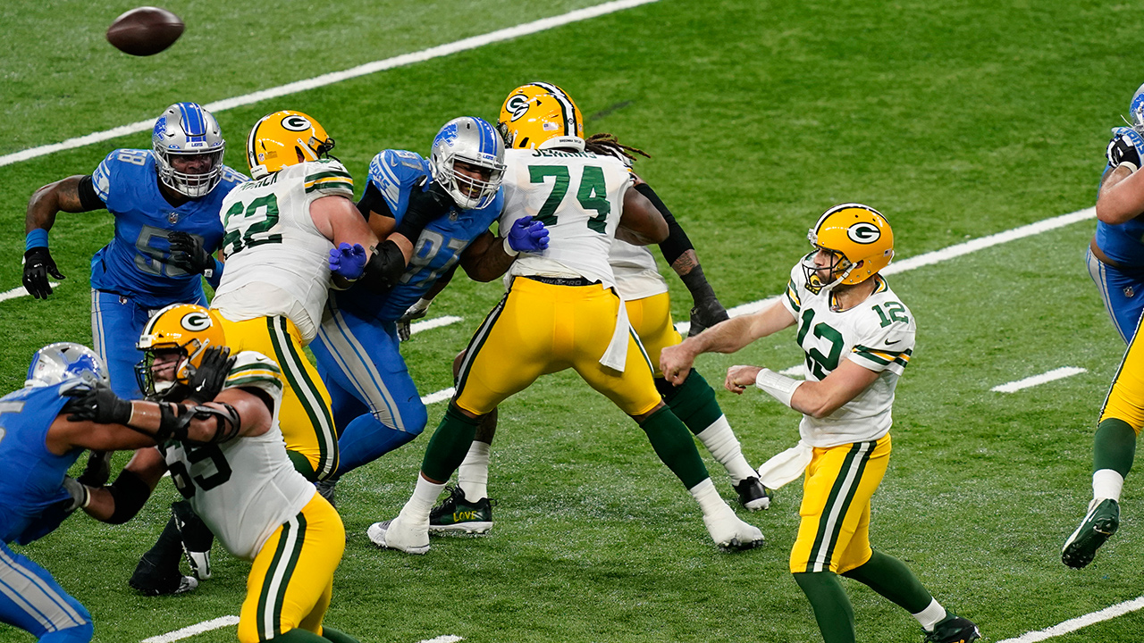 Green Bay Packers quarterback Aaron Rodgers (12) throws during the first half against the Detroit Lions, Sunday, Dec. 13, 2020, in Detroit. (Carlos Osorio/AP)