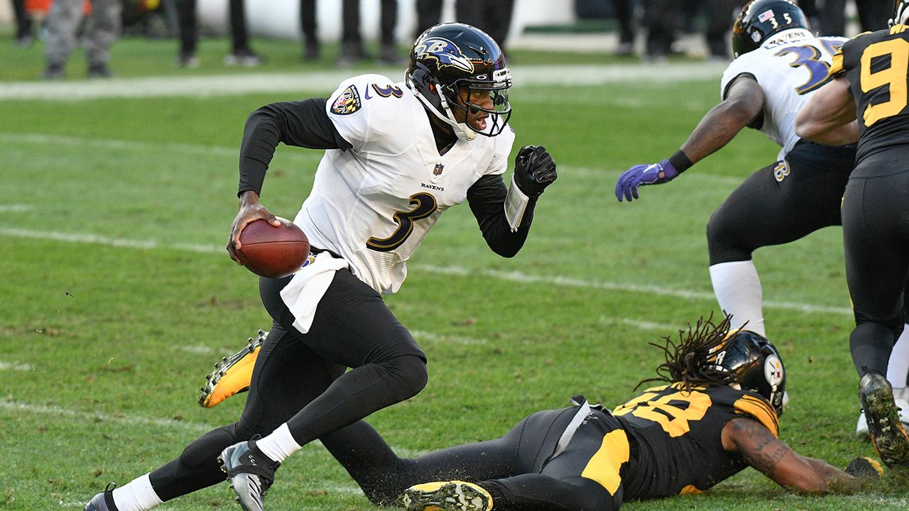 Baltimore Ravens quarterback Robert Griffin III (3) scrambles past Pittsburgh Steelers outside linebacker Bud Dupree (48) during the first half of an NFL football game, Wednesday, Dec. 2, 2020, in Pittsburgh. (Don Wright/AP)