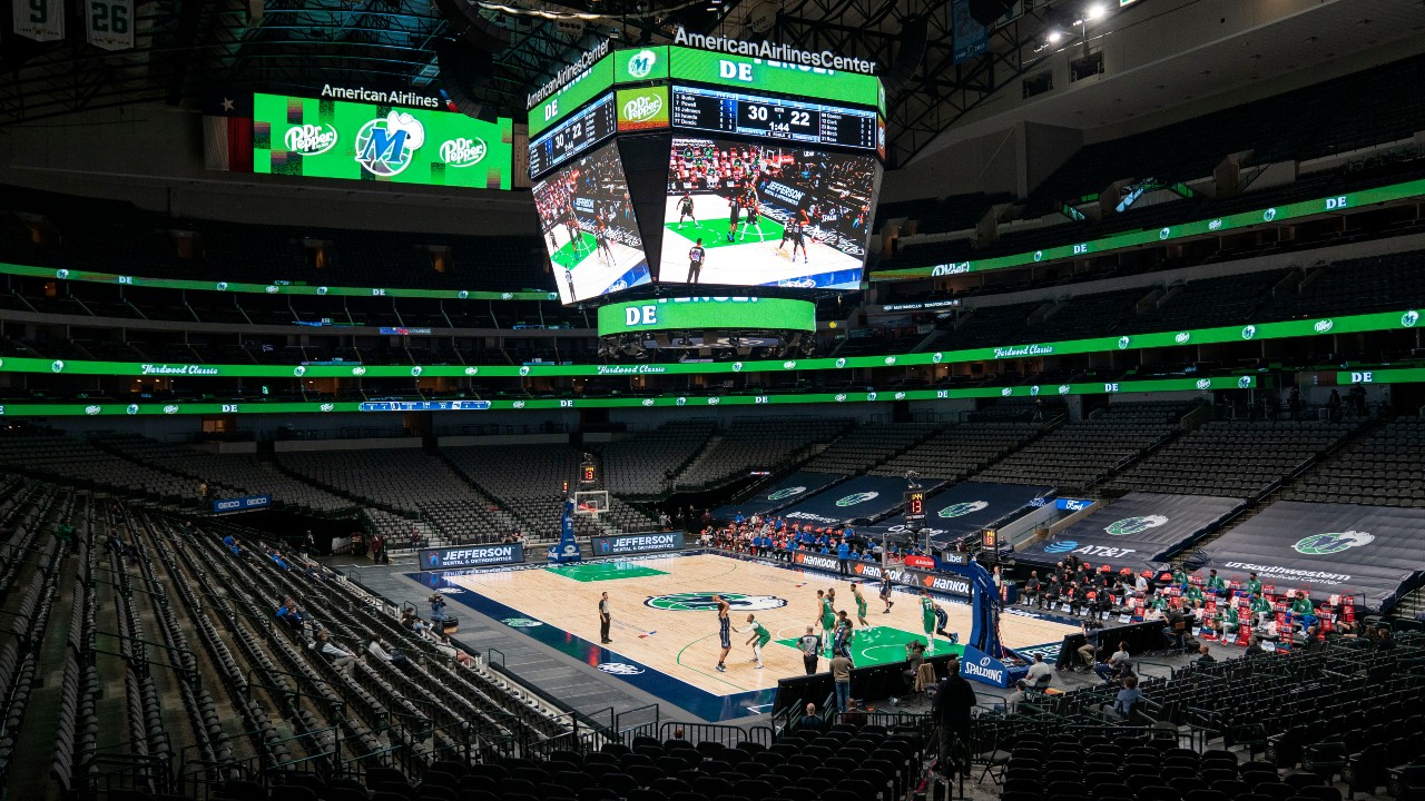 The Orlando Magic and the Dallas Mavericks play in an otherwise empty American Airlines Center during the first half of an NBA basketball game, Saturday, Jan. 9, 2021, in Dallas. (Jeffrey McWhorter / AP)