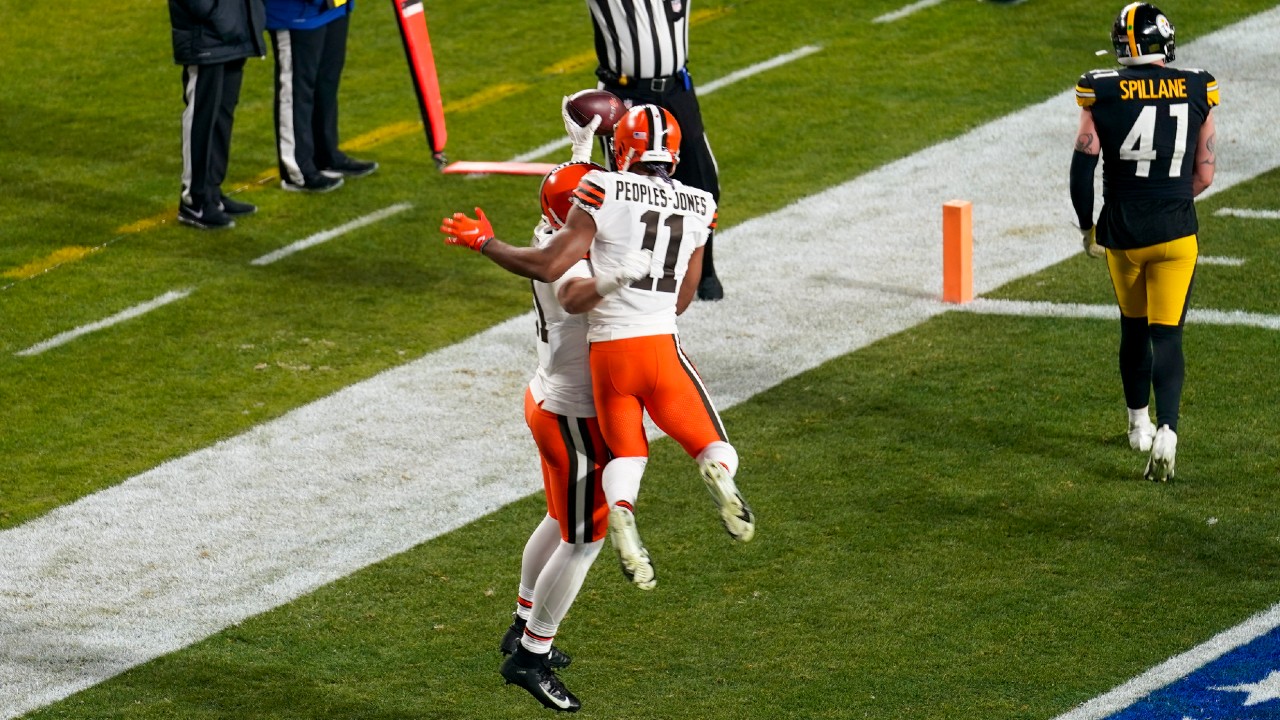 Cleveland Browns tight end Austin Hooper (81) celebrates with Donovan Peoples-Jones (11) after scoring on a 7-yard pass play during the first half of an NFL wild-card playoff football game against the Pittsburgh Steelers, Sunday, Jan. 10, 2021, in Pittsburgh. (Keith Srakocic/AP)