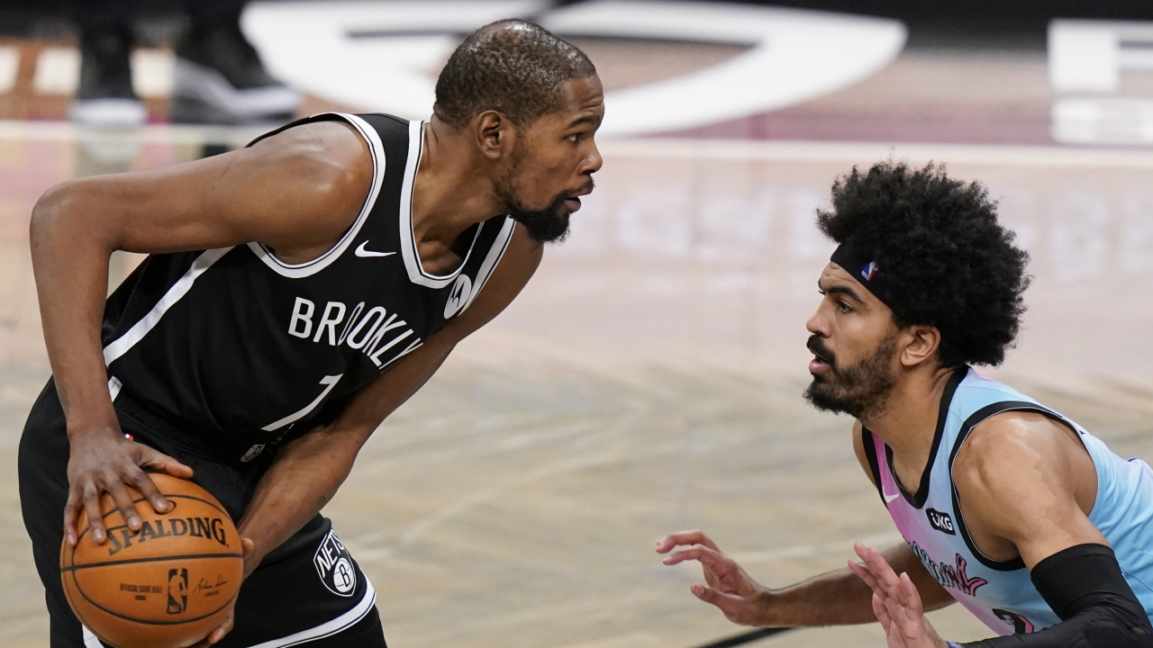 Miami Heat's Gabe Vincent (2) defends against Brooklyn Nets' Kevin Durant (7) during the second half of an NBA basketball game Saturday, Jan. 23, 2021. (Frank Franklin II/AP)