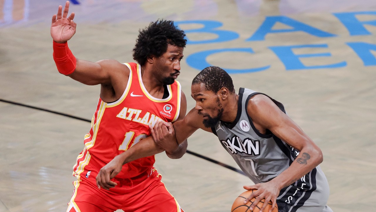 The Nets' Kevin Durant (R) tries to get past the Hawks' Solomon Hill (L) during the first half of the game between the Atlanta Hawks and the Brooklyn Nets. (EPA/JUSTIN LANE SHUTTERSTOCK OUT)