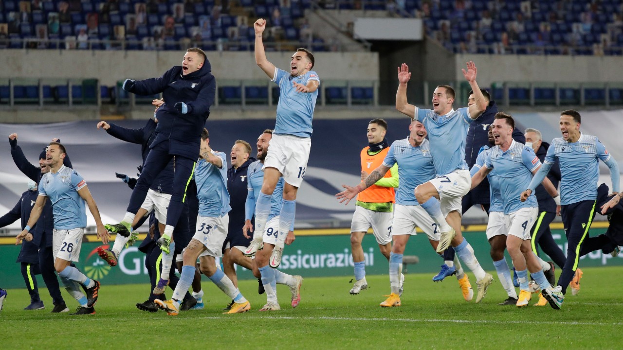 Players of Lazio celebrate after winning the Serie A soccer match between Lazio and Roma, at Rome's Olympic Stadium, Friday, Jan. 15, 2021. (Andrew Medichini/AP)