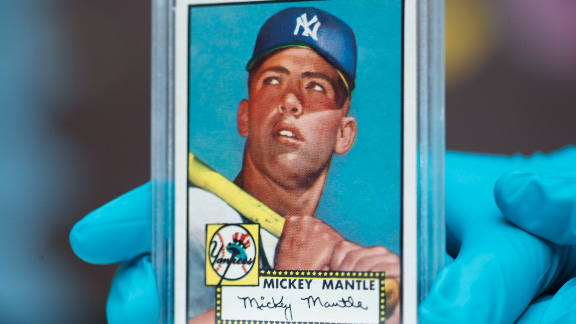The "Holy Grail" of baseball cards, a 1952 Topps Mickey Mantle that is valued at more than $10 million, is put on display as part of baseball memorabilia exhibit at the Colorado History Museum. (David Zalubowski/AP)
