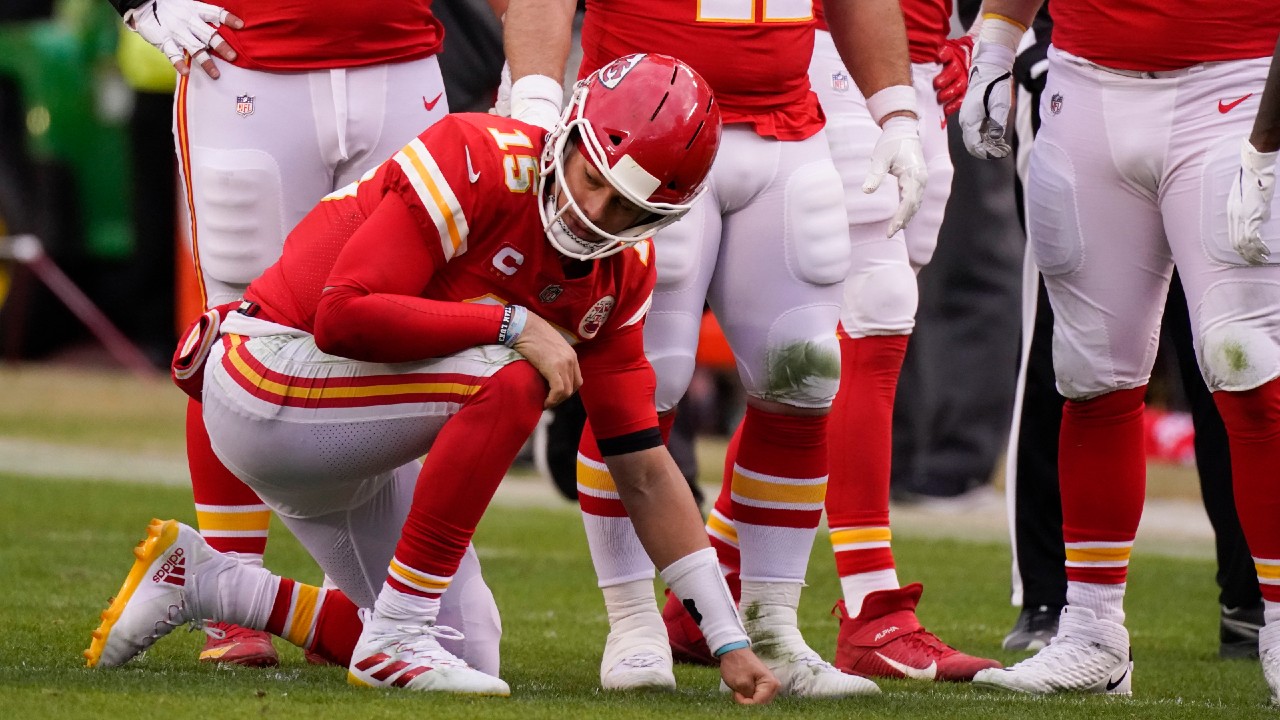 Kansas City Chiefs quarterback Patrick Mahomes kneels on the field after getting injured. (Charlie Riedel/AP)