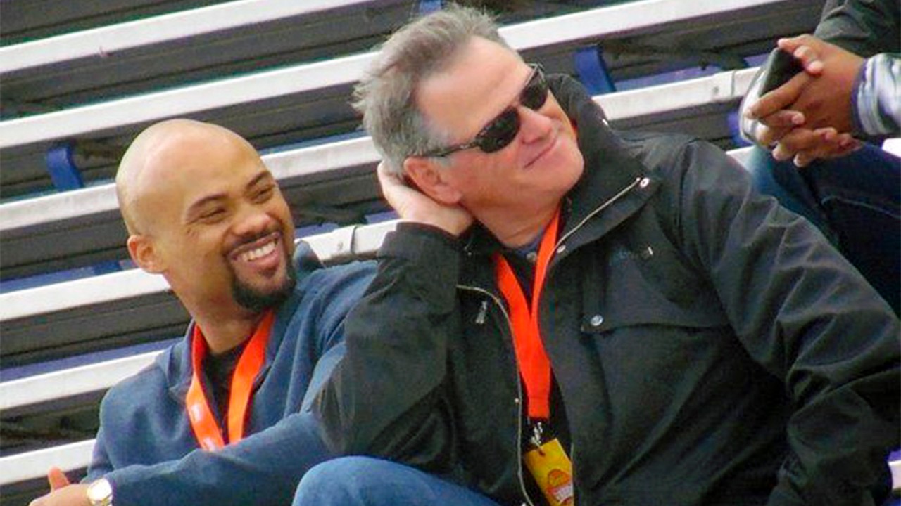 Terry Fontenot, left, and New Orleans Saints general manager Mickey Loomis watch Senior Bowl practice in Mobile, Ala., in this Jan. 20, 2015. (Evan Woodbery/The Times-Picayune/The New Orleans Advocate via AP)