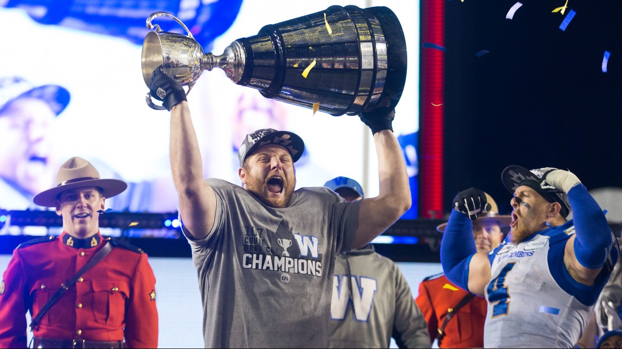 Winnipeg Blue Bombers' Jake Thomas celebrates winning the 107th Grey Cup against the Hamilton Tiger Cats. (Todd Korol/CP)