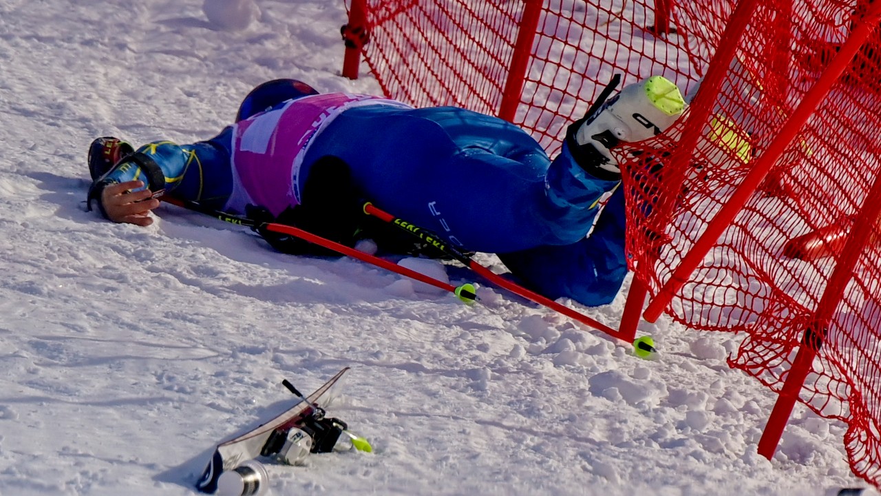 Injured Tommy Ford from the US during the first run of the men's giant slalom race at the FIS Alpine Skiing World Cup in Adelboden, Switzerland, Saturday, January 9, 2021. (Jean-Christophe Bott/Keystone via AP)