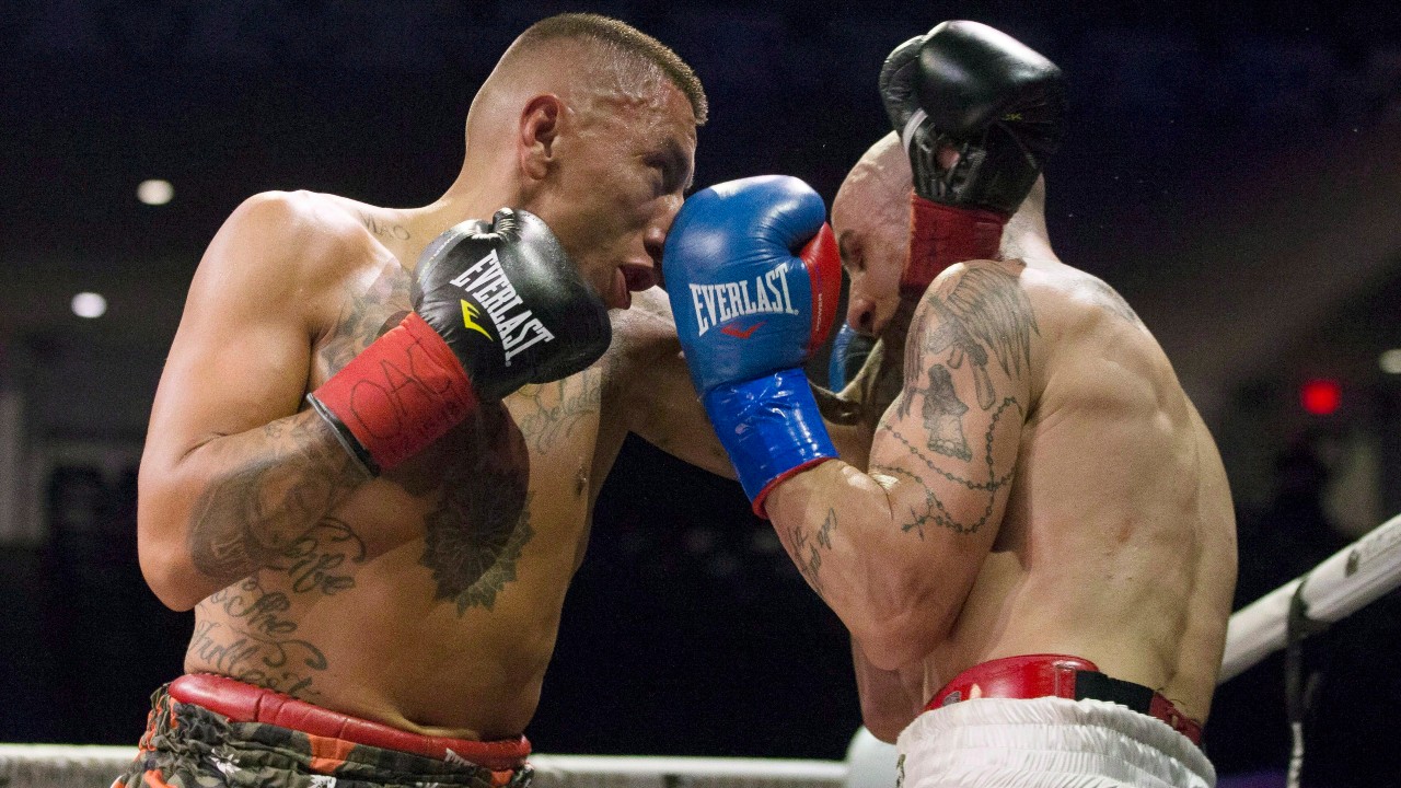 Toronto fighter Samuel Vargas (left) puts Argentibe boxer Gabriel Pereiro into a corner during their bout. (Chris Young/CP)