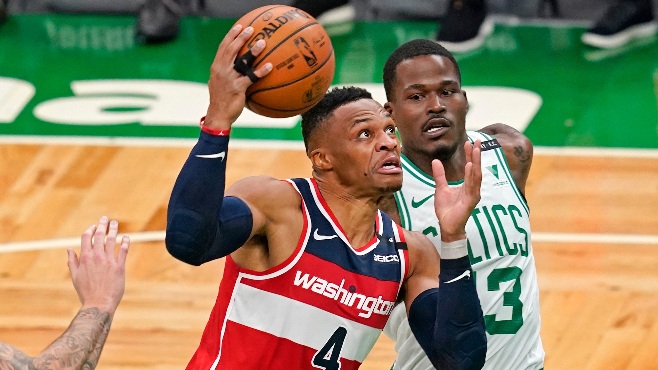 Washington Wizards guard Russell Westbrook (4) drives against Boston Celtics guard Javonte Green during the first quarter of an NBA basketball game. (Elise Amendola/AP)