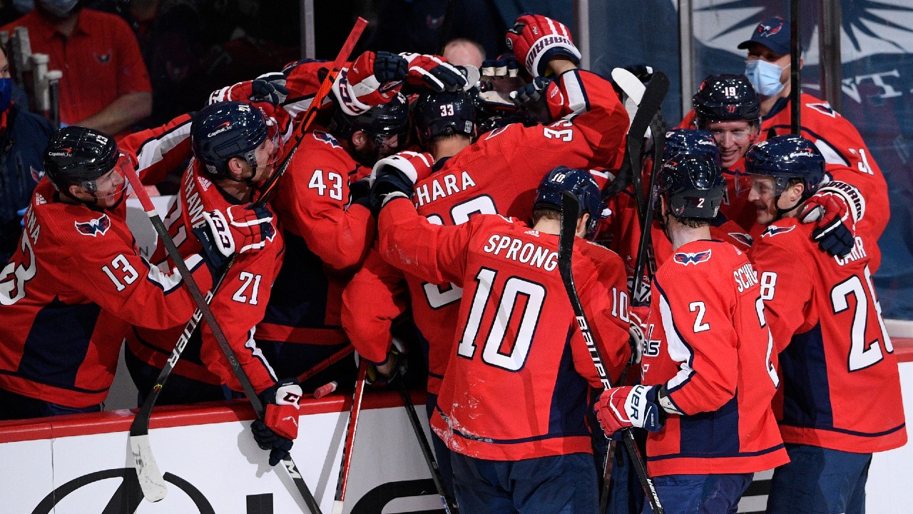 Washington Capitals defenceman Zdeno Chara (33) is mobbed by his teammates after he scored a goal during the second period of the team's NHL hockey game against the New York Islanders, Thursday, Jan. 28, 2021, in Washington. (Nick Wass/AP)