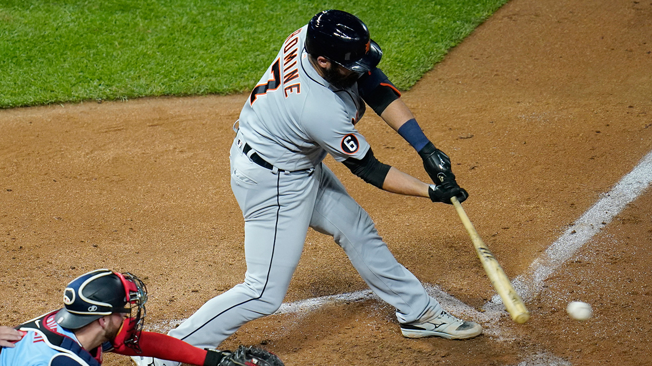 Detroit Tigers' Austin Romine hits an RBI single with the bases loaded off Minnesota Twins' pitcher Tyler Duffey in the sixth inning of a baseball game Tuesday, Sept. 22, 2020, in Minneapolis. (Jim Mone/AP)