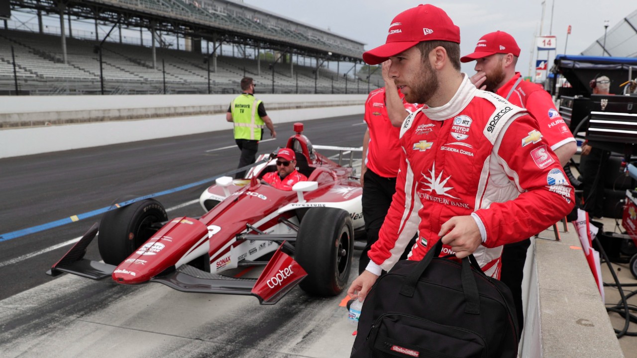Ed Jones, of United Arab Emirates, carries his gear as the team leaves the pit area during practice for the Indianapolis 500 IndyCar auto race at Indianapolis Motor Speedway, Thursday, May 16, 2019 in Indianapolis. (Michael Conroy/AP)