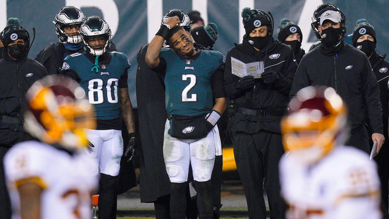 Philadelphia Eagles' Jalen Hurts scratches his head on the sideline during the second half against the Washington Football Team, Sunday, Jan. 3, 2021, in Philadelphia. (Chris Szagola/AP)