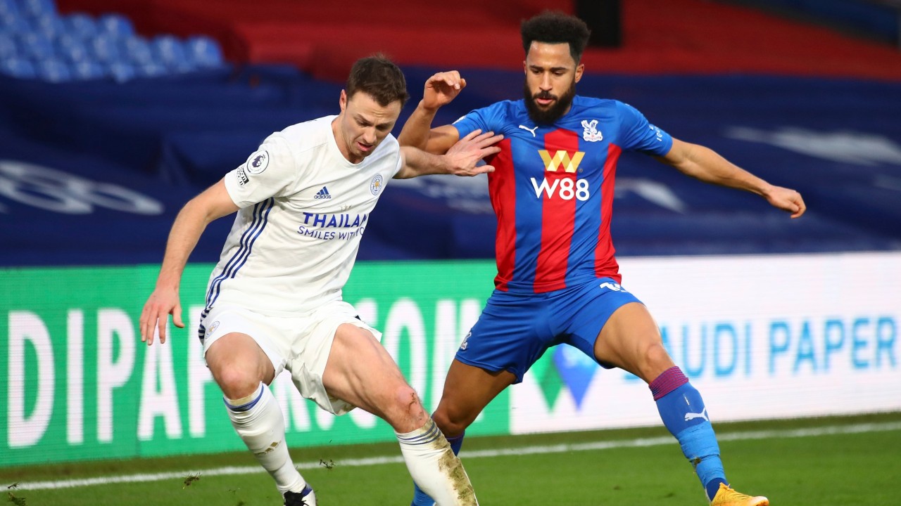 Leicester City's Jonny Evans, left, and Crystal Palace's Andros Townsend challenge for the ball during the English Premier League soccer match between Crystal Palace and Leicester City at Selhurst Park stadium in London, Monday, Dec., 28, 2020. (Marc Atkins/Pool via AP)