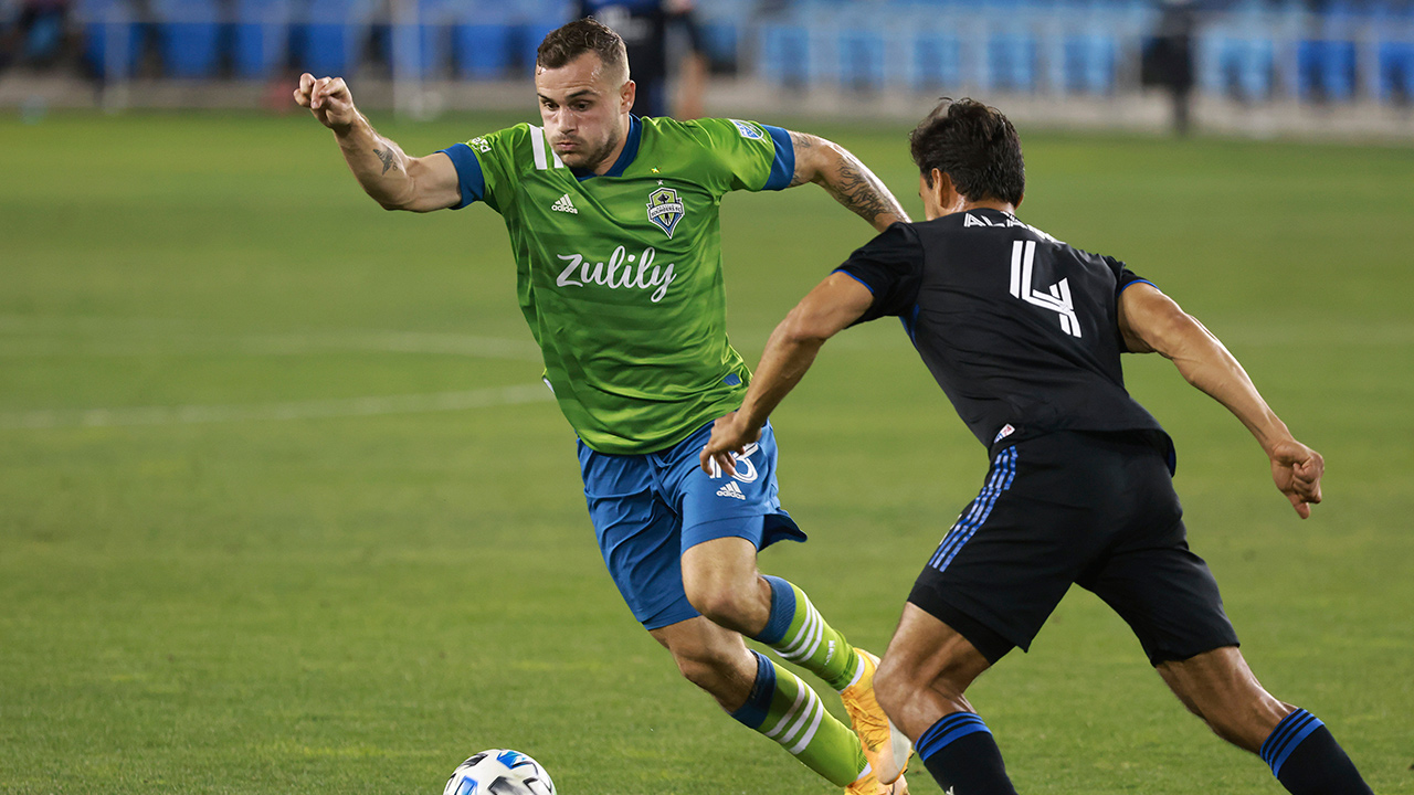 Seattle Sounders forward Jordan Morris (13) chases down a ball against San Jose Earthquakes defender Oswaldo Alanis (4) during the second half of an MLS soccer match, Sunday, Oct. 18, 2020, in San Jose, Calif. (Josie Lepe/AP)
