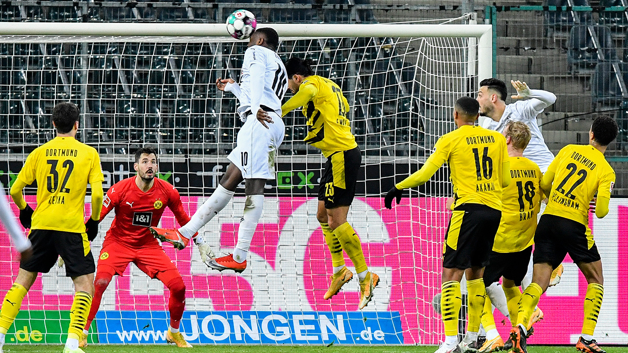 Moenchengladbach's Marcus Thuram scores during the German Bundesliga soccer match between Borussia Moenchengladbach and Borussia Dortmund in Moenchengladbach, Germany, Friday, Jan. 22, 2021. (Martin Meissner/AP)