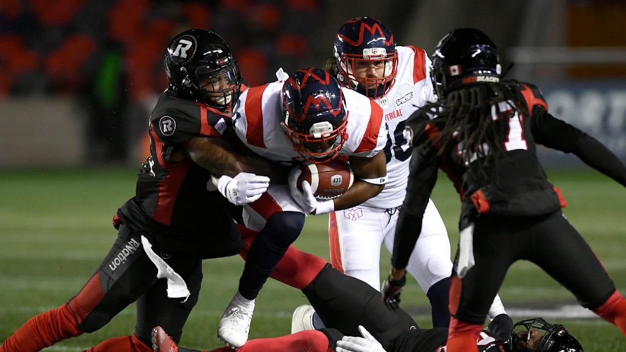 Montreal Alouettes running back William Stanback (31) is tackled by Ottawa Redblacks linebacker Jerod Fernandez (35) during first half CFL football action in Ottawa on Friday, Nov. 1, 2019. (Justin Tang/CP)