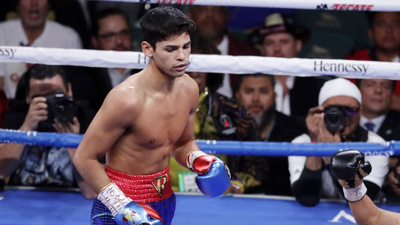 Garcia drops Luke Campbell in seventh round to win a lightweight title fight (Isaac Brekken/AP)