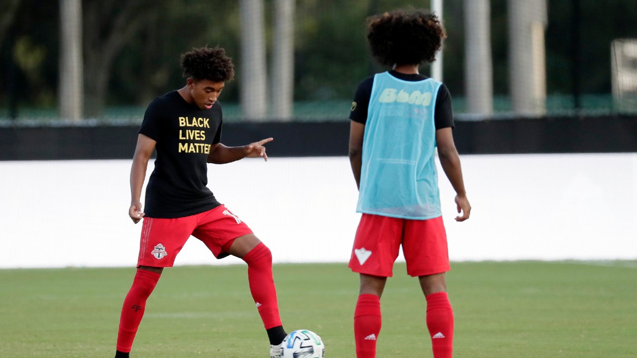 Toronto FC forwards Jahkeele Marshall-Rutty, left, and Jayden Nelson warm up before the team's MLS soccer match against the Montreal Impact, Thursday, July 16, 2020, in Kissimmee, Fla. (John Raoux/AP)