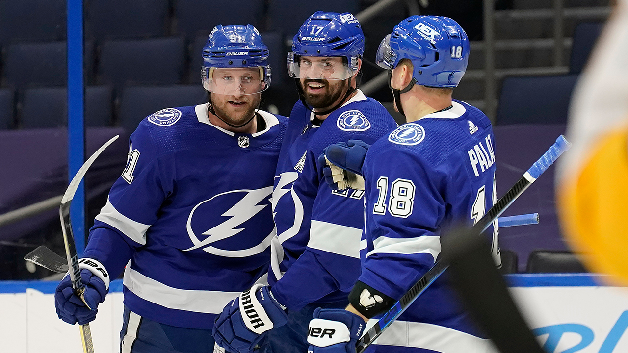 Tampa Bay Lightning centre Steven Stamkos (91) celebrates with left wing Alex Killorn (17) and left wing Ondrej Palat (18) during the second period of an NHL hockey game. (Chris O'Meara/AP)