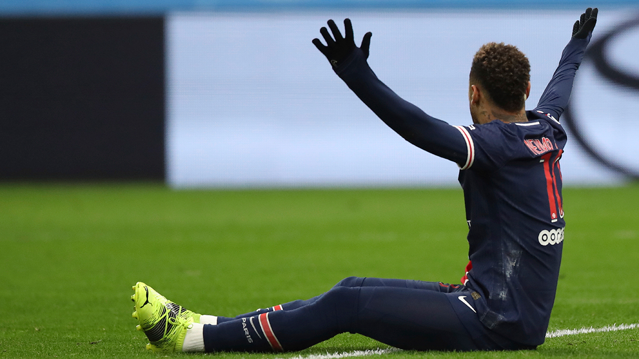 PSG's Neymar reacts to the referee Benoit Bastien as he claims a foul after a challenge by Marseille's Alvaro during the French League One soccer match between Olympique de Marseille and Paris Saint-Germain at the Velodrome stadium in Marseille, southern France, Sunday, Feb. 7, 2021. (Daniel Cole/AP)