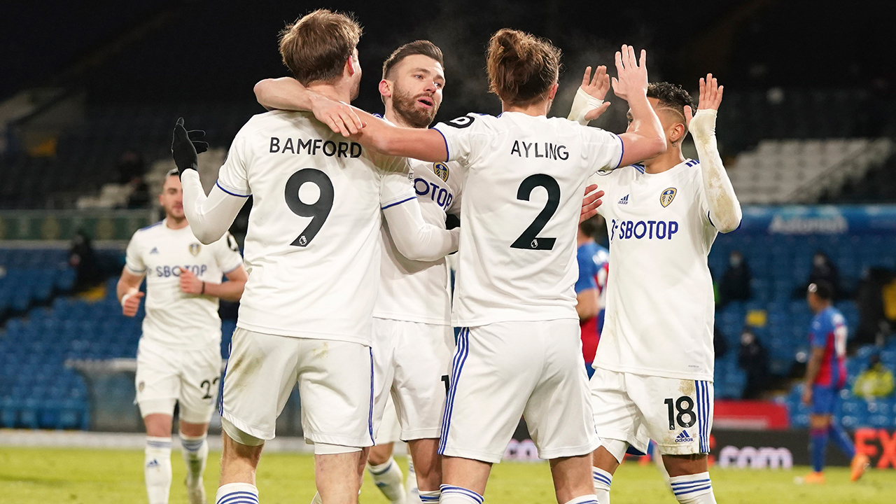 Leeds United players celebrate after Leeds United's Patrick Bamford scored his side's second goal during the English Premier League soccer match between Leeds United and Crystal Palace at Elland Road Stadium in Leeds, England, Monday, Feb. 8, 2021. (AP Photo/Jon Super, Pool)